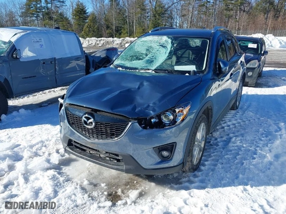 2015 Mazda CX-5 Grand Touring with VIN JM3KE4DY1F0541592, listed as a IAAI auction lot 41585018 with 113,016 mi miles. Bid and sale history available at carsss.com. Image 6.