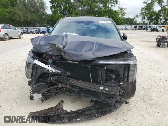2025 Kia Carnival SX with VIN KNDNE5K37S6490478, listed as a Copart auction lot 51389565 with 6,929 mi miles and Salvage Title. Bid and sale history available at DreamBid. Image 5.