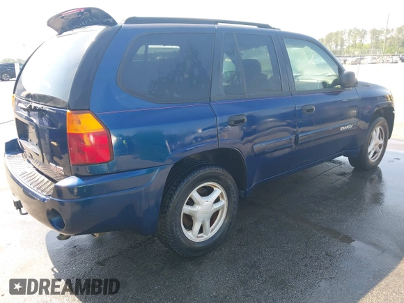 2004 GMC Envoy SLE with VIN 1GKDT13S242391968, listed as a IAAI auction lot 42079420 with 234,611 mi miles. Bid and sale history available at carsss.com. Image 4.