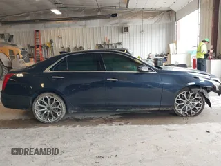 2015 Cadillac CTS AWD z VIN 1G6AW5SXXF0136481, wystawiony jako IAAI lot #42173024 z przebiegiem 128 984 mil mil oraz . Historia ofert i sprzedaży dostępna na DreamBid. Obrazek 14.