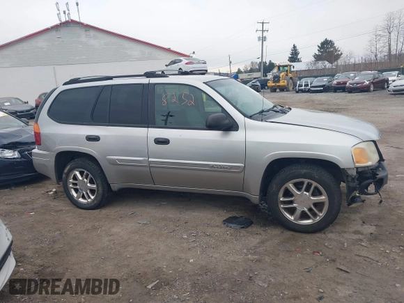 2004 GMC Envoy SLE with VIN 1GKDT13SX42135951, listed as a IAAI auction lot 41668252 with 216,193 mi miles. Bid and sale history available at carsss.com. Image 14.