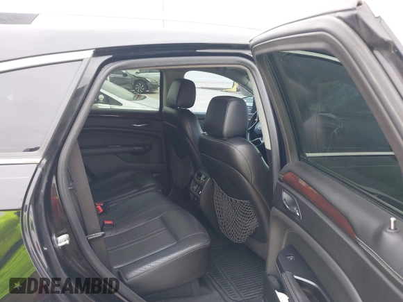 2015 Cadillac SRX Premium Collection z VIN 3GYFNDE3XFS576695, wystawiony jako IAAI lot #41612836 z przebiegiem Nie podano mil oraz . Historia ofert i sprzedaży dostępna na DreamBid. Obrazek 8.