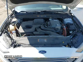 2017 Ford Fusion Hybrid SE z VIN 3FA6P0LU8HR396572, wystawiony jako IAAI lot #41997684 z przebiegiem 272 803 mil mil oraz . Historia ofert i sprzedaży dostępna na DreamBid. Obrazek 10.