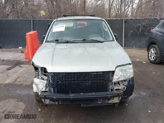 2005 Mercury Mariner Luxury with VIN 4M2YU57175DJ05986, listed as a IAAI auction lot 41713180 with 243,682 mi miles. Bid and sale history available at carsss.com. Image 12.