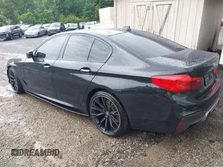2018 BMW 5 Series M550i xDrive with VIN WBAJB9C5XJB286923, listed as a IAAI auction lot 42527301 with 76,923 mi miles and . Bid and sale history available at DreamBid. Image 3.