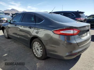 2016 Ford Fusion SE Hybrid with VIN 3FA6P0LU3GR307666, listed as a Copart auction lot 57444365 with 127,786 mi miles and Salvage title. Bid and sale history available at DreamBid. Image 2.