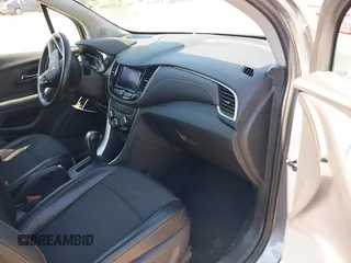2020 Chevrolet Trax LT with VIN 3GNCJLSBXLL322296, listed as a IAAI auction lot 42030809 with 51,367 mi miles and . Bid and sale history available at DreamBid. Image 5.