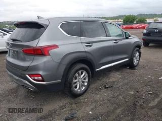 2019 Hyundai Santa Fe SEL z VIN 5NMS3CAD7KH035429, wystawiony jako IAAI lot #42323641 z przebiegiem 60 909 mil mil oraz . Historia ofert i sprzedaży dostępna na DreamBid. Obrazek 4.