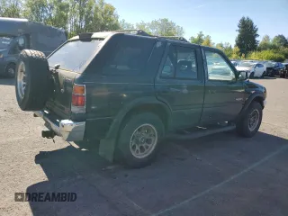 1995 Honda Passport z VIN 4S6CM58V0S4425974, wystawiony jako Copart lot #73371724 z przebiegiem 161 173 mil mil oraz Tytuł czysty. Historia ofert i sprzedaży dostępna na DreamBid. Obrazek 3.