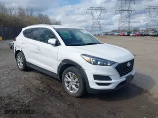 2019 Hyundai Tucson Value with VIN KM8J3CA42KU013032, listed as a IAAI auction lot 41880465 with 51,332 mi miles. Bid and sale history available at carsss.com. Image 6.