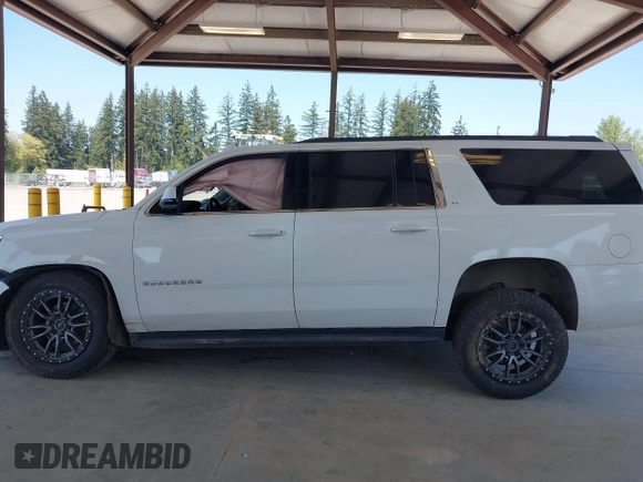 2019 Chevrolet Suburban LT with VIN 1GNSKHKC2KR384572, listed as a IAAI auction lot 42118571 with Not Provided miles and . Bid and sale history available at DreamBid. Image 13.