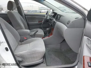2004 Toyota Corolla CE with VIN 1NXBR32E34Z335238, listed as a IAAI auction lot 41987476 with 124,999 mi miles. Bid and sale history available at carsss.com. Image 5.