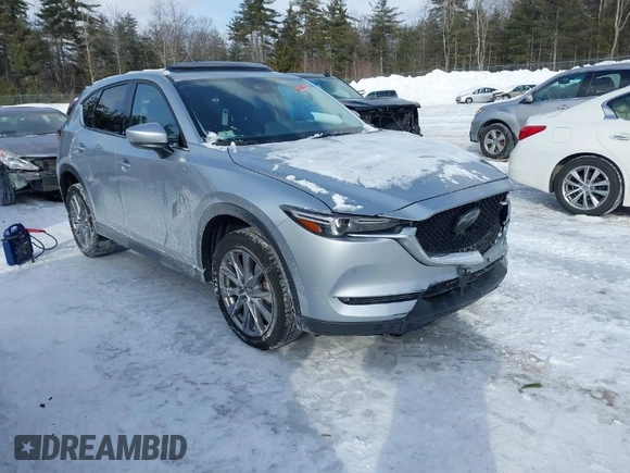 2021 Mazda CX-5 Grand Touring Reserve with VIN JM3KFBAY0M0377030, listed as a IAAI auction lot 41606709 with 39,590 mi miles. Bid and sale history available at carsss.com. Image 1.