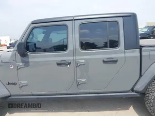 2021 Jeep Gladiator Sport S z VIN 1C6JJTAM1ML607525, wystawiony jako IAAI lot #41941550 z przebiegiem 59 283 mil mil oraz . Historia ofert i sprzedaży dostępna na DreamBid. Obrazek 14.