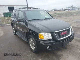 2002 GMC Envoy SLT with VIN 1GKDT13S222143135, listed as a IAAI auction lot 42136672 with 206,064 mi miles. Bid and sale history available at carsss.com. Image 6.