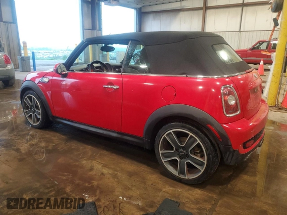 2010 MINI Convertible S with VIN WMWMS3C50ATY51636, listed as a Copart auction lot 66097715 with 103,525 mi miles and Salvage title. Bid and sale history available at DreamBid. Image 2.