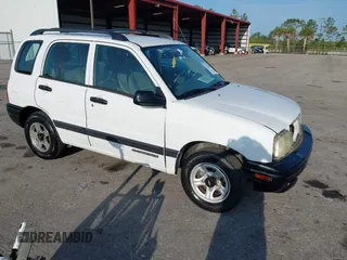 2001 Chevrolet Tracker z VIN 2CNBE13C916939402, wystawiony jako IAAI lot #42232082 z przebiegiem 103 693 mil mil oraz . Historia ofert i sprzedaży dostępna na DreamBid. Obrazek 1.