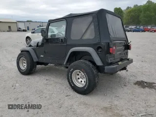 2000 Jeep Wrangler Sport with VIN 1J4FA49S9YP743515, listed as a Copart auction lot 53906305 with 247,349 mi miles and Salvage title. Bid and sale history available at DreamBid. Image 2.