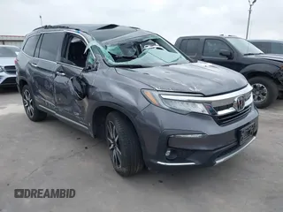 2019 Honda Pilot Touring 8-Passenger with VIN 5FNYF5H95KB033615, listed as a IAAI auction lot 42078467 with 84,433 mi miles and . Bid and sale history available at DreamBid. Image 1.
