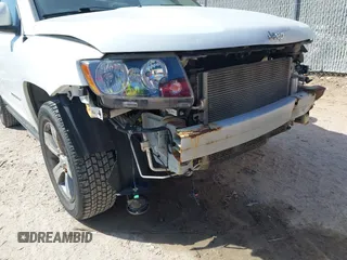 2016 Jeep Compass High Altitude with VIN 1C4NJDEB4GD767731, listed as a IAAI auction lot 41977400 with 99,890 mi miles and . Bid and sale history available at DreamBid. Image 19.