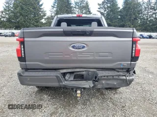 2023 Ford F-150 Lightning Pro with VIN 1FTVW1EL8PWG38419, listed as a Copart auction lot 47630535 with 11,940 mi miles and Salvage Title. Bid and sale history available at DreamBid. Image 6.