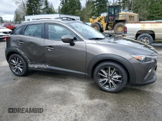 2017 Mazda CX-3 Touring with VIN JM1DKFC79H0148103, listed as a Copart auction lot 51343025 with 79,765 mi miles and Salvage Title. Bid and sale history available at DreamBid. Image 4.