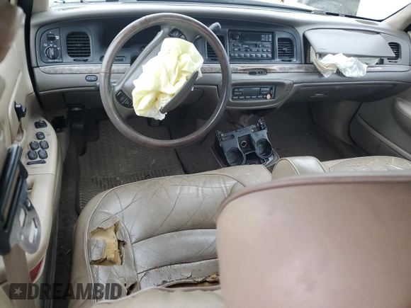 2000 Ford Crown Victoria LX z VIN 2FAFP74W4YX120352, wystawiony jako Copart lot #79833264 z przebiegiem Nie podano mil oraz Szkoda całkowita • Salvage title. Historia ofert i sprzedaży dostępna na DreamBid. Obrazek 8.