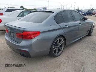 2018 BMW 5 Series M550i xDrive with VIN WBAJB9C55JB035694, listed as a IAAI auction lot 42122730 with 61,561 mi miles and . Bid and sale history available at DreamBid. Image 4.