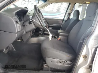 2003 Jeep Grand Cherokee Laredo with VIN 1J4GW48S23C617830, listed as a Copart auction lot 57481565 with 122,745 mi miles and Salvage title. Bid and sale history available at DreamBid. Image 7.