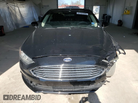 2018 Ford Fusion SE z VIN 3FA6P0HDXJR130677, wystawiony jako Copart lot #51737345 z przebiegiem 129 918 mil mil oraz Szkoda całkowita • Salvage title. Historia ofert i sprzedaży dostępna na DreamBid. Obrazek 5.
