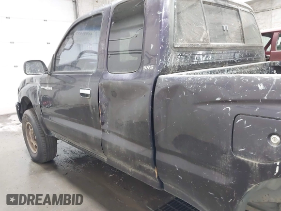 1999 Toyota Tacoma with VIN 4TAWM72N5XZ433296, listed as a IAAI auction lot 42595432 with 233,075 mi miles and . Bid and sale history available at DreamBid. Image 6.