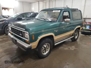 1987 Ford Bronco z VIN 1FMCU14T8HUA51662, wystawiony jako Copart lot #74972024 z przebiegiem 26 362 mil mil oraz Szkoda całkowita • Salvage title. Historia ofert i sprzedaży dostępna na DreamBid. Obrazek 1.