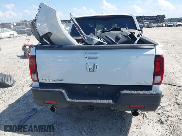 2022 Honda Ridgeline RTL with VIN 5FPYK3F51NB025152, listed as a IAAI auction lot 42325957 with 54,632 mi miles and . Bid and sale history available at DreamBid. Image 16.