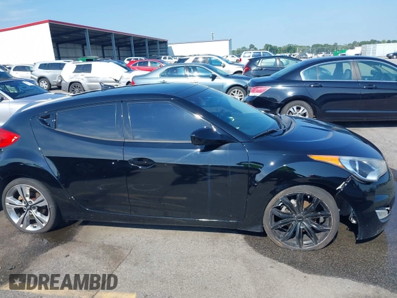 2012 Hyundai Veloster w/Black Int z VIN KMHTC6AD4CU078413, wystawiony jako IAAI lot #42611032 z przebiegiem 142 295 mil mil oraz . Historia ofert i sprzedaży dostępna na DreamBid. Obrazek 13.