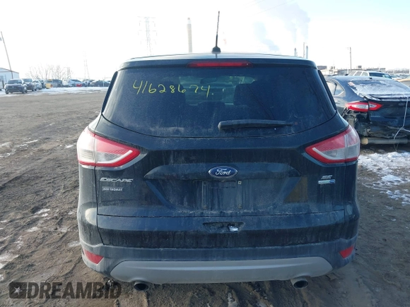 2014 Ford Escape SE with VIN 1FMCU9GX2EUD52176, listed as a IAAI auction lot 41628674 with 101,049 mi miles. Bid and sale history available at carsss.com. Image 16.