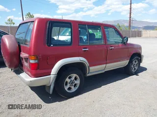 1999 Isuzu Trooper S with VIN JACDJ58X5X7928609, listed as a IAAI auction lot 42098158 with 159,674 mi miles and . Bid and sale history available at DreamBid. Image 4.