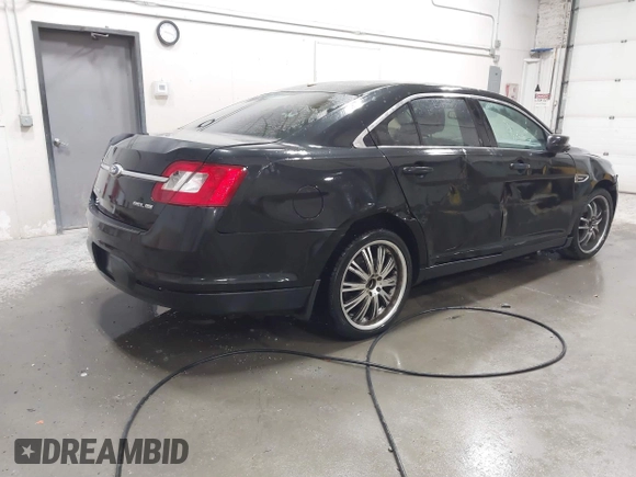 2011 Ford Taurus SEL with VIN 1FAHP2EW4BG160633, listed as a IAAI auction lot 41778406 with 125,934 mi miles. Bid and sale history available at carsss.com. Image 4.