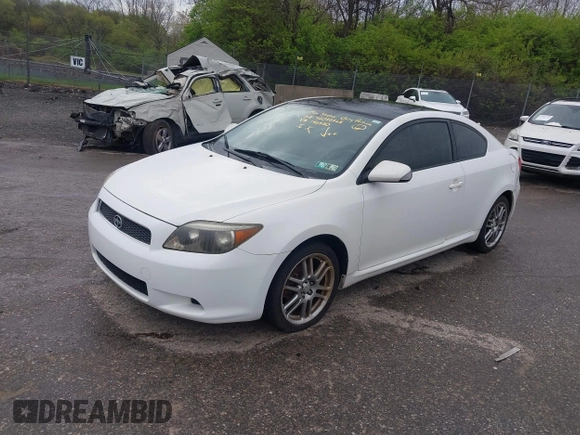 2007 Scion tC Spec with VIN JTKDE177270146530, listed as a IAAI auction lot 42033365 with 128,482 mi miles. Bid and sale history available at carsss.com. Image 2.