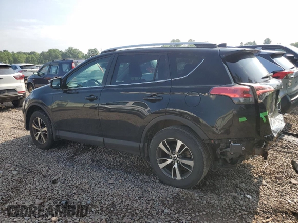 2018 Toyota RAV4 XLE with VIN 2T3RFREV0JW765995, listed as a Copart auction lot 63968785 with 114,598 mi miles and Salvage title. Bid and sale history available at DreamBid. Image 2.