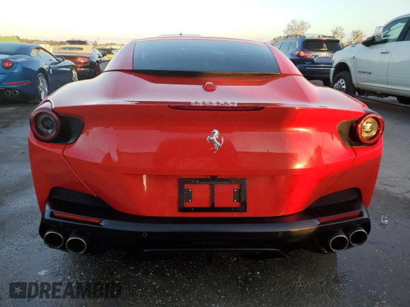 2019 Ferrari Portofino z VIN ZFF89FPA0K0242592, wystawiony jako Copart lot #74249014 z przebiegiem Nie podano mil oraz Nie do naprawy. Historia ofert i sprzedaży dostępna na DreamBid. Obrazek 6.
