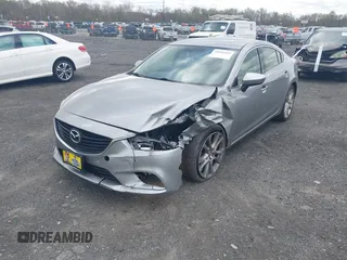 2014 Mazda 6 i Touring with VIN JM1GJ1V64E1147549, listed as a IAAI auction lot 42041025 with 124,400 mi miles and . Bid and sale history available at DreamBid. Image 2.