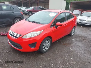 2012 Ford Fiesta SE z VIN 3FADP4BJ2CM110873, wystawiony jako IAAI lot #42347413 z przebiegiem 191 727 mil mil oraz . Historia ofert i sprzedaży dostępna na DreamBid. Obrazek 2.