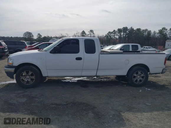 2000 Ford F-150 XL with VIN 1FTRX17LXYNC39983, listed as a IAAI auction lot 41750277 with 170,016 mi miles. Bid and sale history available at carsss.com. Image 14.