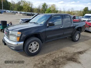 2011 GMC Canyon SLE1 with VIN 1GTH6MFE8B8102114, listed as a Copart auction lot 74137234 with 150,598 mi miles and Salvage Title. Bid and sale history available at carsss.com. Image 1.