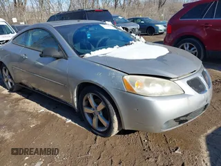 2006 Pontiac G6 GTP with VIN 1G2ZM151264260764, listed as a IAAI auction lot 41306033 with 168,394 mi miles. Bid and sale history available at carsss.com. Image 1.