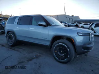 2025 Rivian R1S Adventure with VIN 7PDSGBBA0SN051096, listed as a Copart auction lot 87441054 with 30 mi miles and Salvage Title. Bid and sale history available at carsss.com. Image 4.