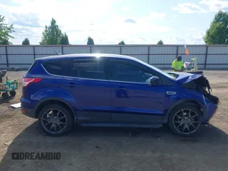 2013 Ford Escape SE with VIN 1FMCU9GXXDUB70983, listed as a IAAI auction lot 42432050 with 97,515 mi miles and . Bid and sale history available at DreamBid. Image 14.