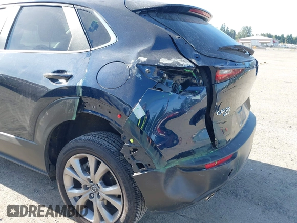 2023 Mazda CX-30 S Select with VIN 3MVDMBBM4PM558831, listed as a IAAI auction lot 42432750 with 12,468 mi miles and . Bid and sale history available at DreamBid. Image 6.