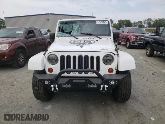 2013 Jeep Wrangler Unlimited Sahara with VIN 1C4HJWEG9DL628684, listed as a Copart auction lot 57672175 with 69,010 mi miles and Salvage title. Bid and sale history available at DreamBid. Image 5.