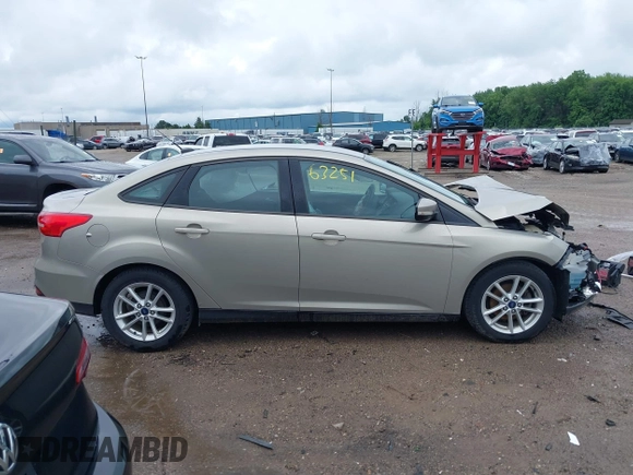 2016 Ford Focus SE z VIN 1FADP3F28GL300925, wystawiony jako IAAI lot #42563251 z przebiegiem 93 247 mil mil oraz . Historia ofert i sprzedaży dostępna na DreamBid. Obrazek 14.